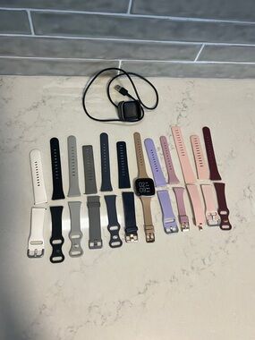 Rose Gold Fitbit Versa 2 Smartwatch with Multiple Silicone Bands